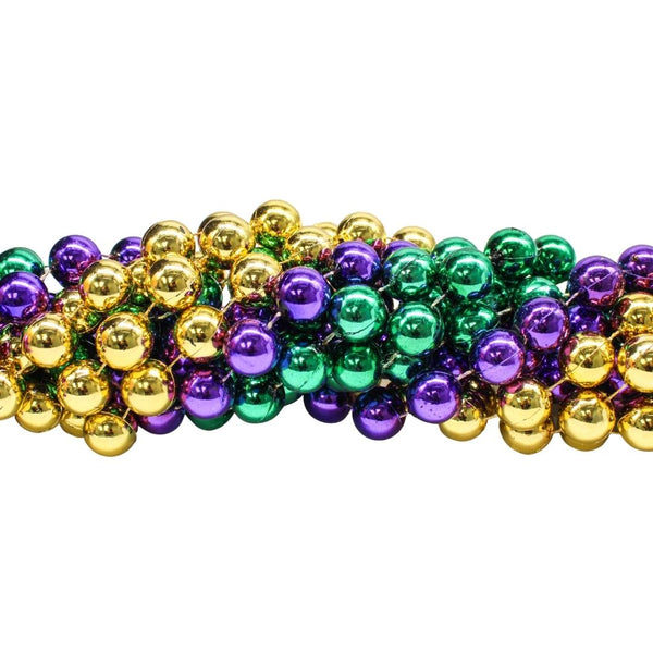 Colorful Mardi gras beads background. Green, purple and gold Merdi