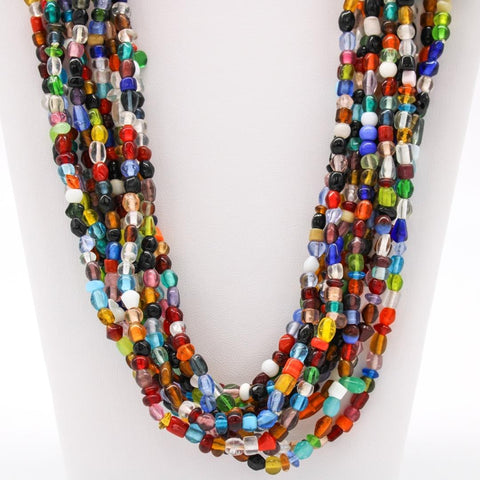 Multicolored beaded necklace featuring wood, pearl, and glass beads.  Approximately 32